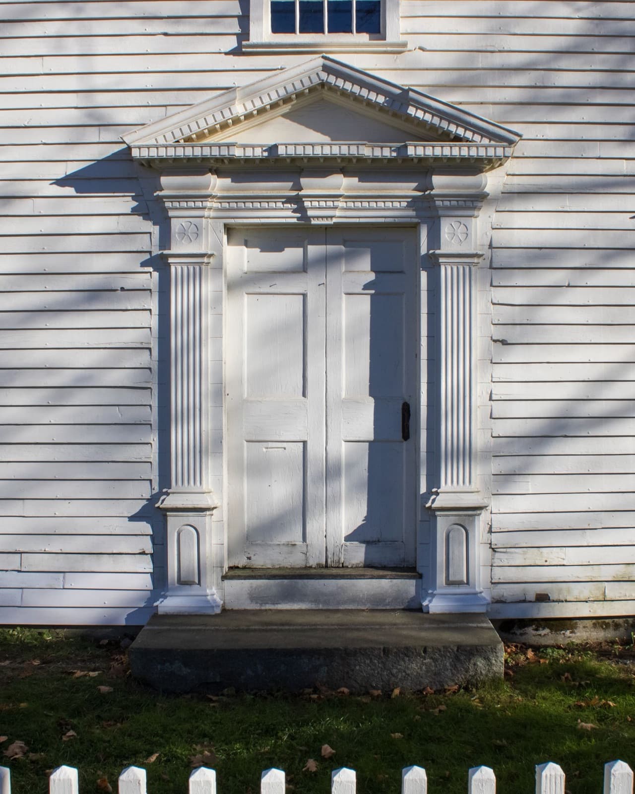 White colonial doorway with classic trim