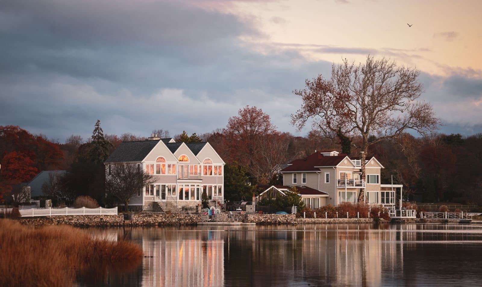 Charming waterfront residence reflecting in a calm lake