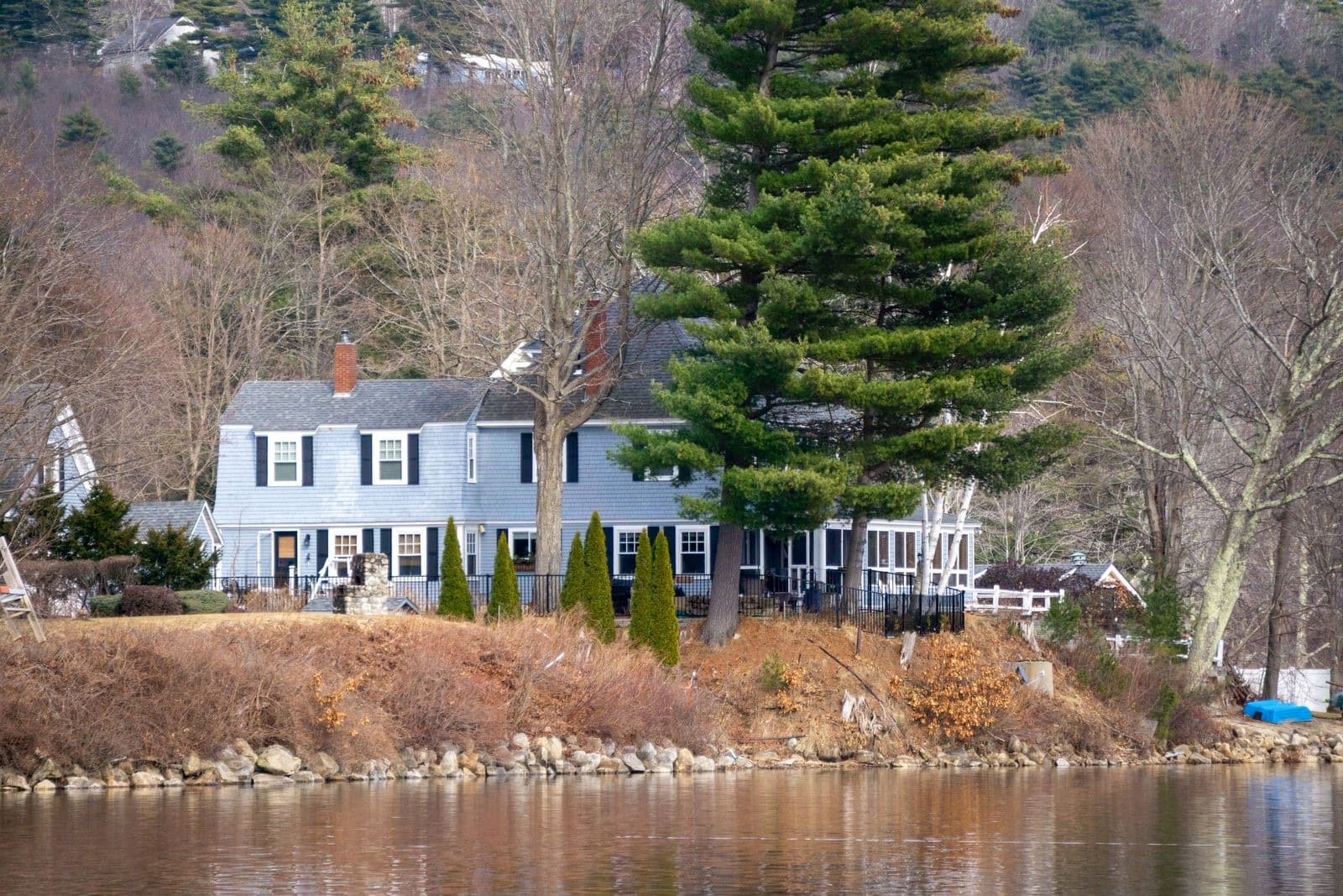 Beautiful lakeside house amid lush trees