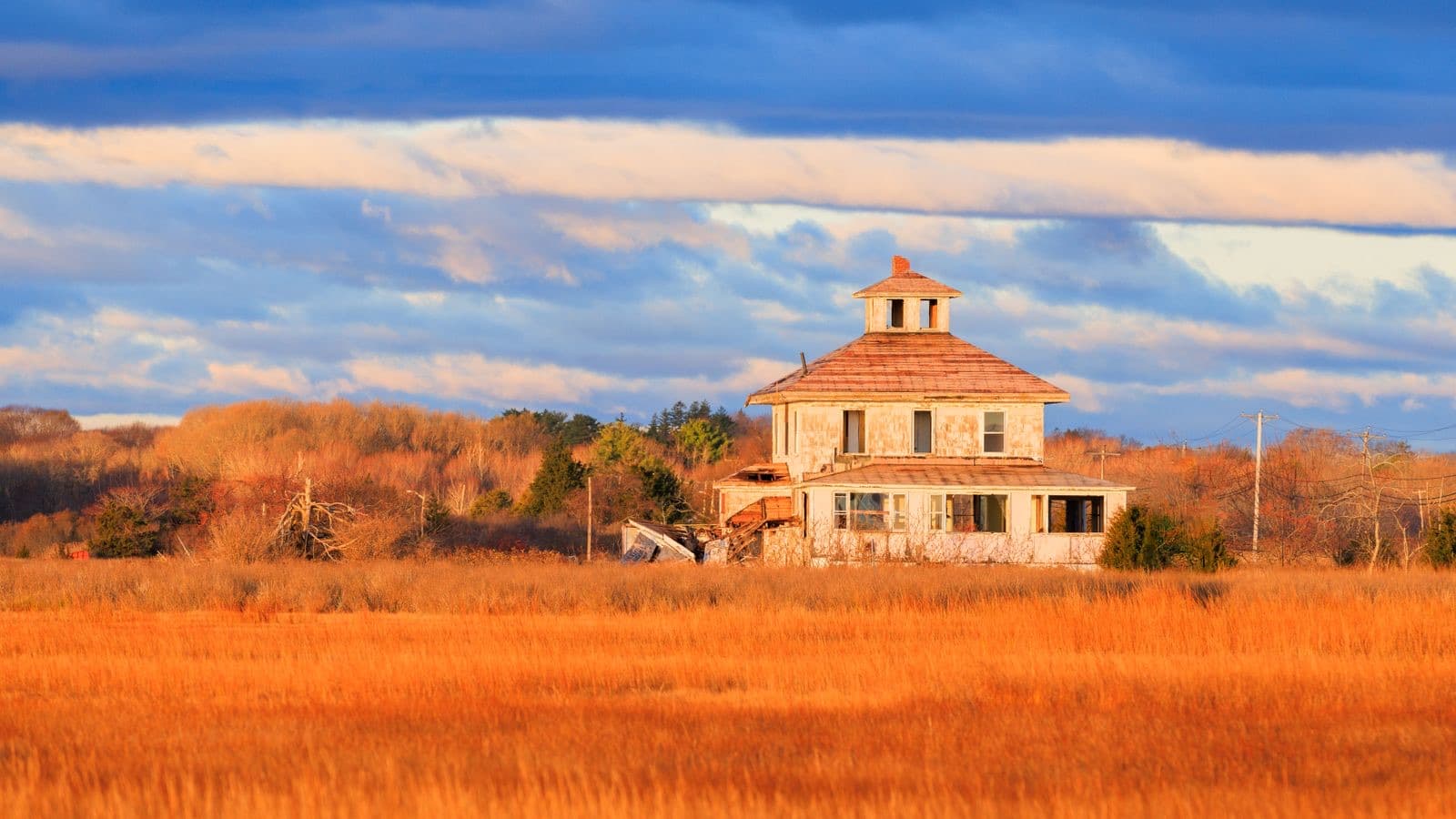 Rustic New England house with vibrant fall colors
