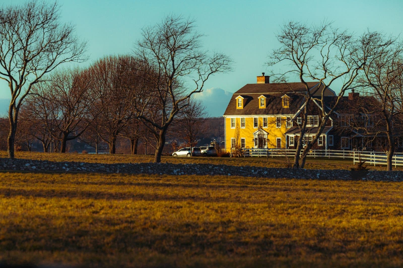 Picturesque yellow country house at golden hour