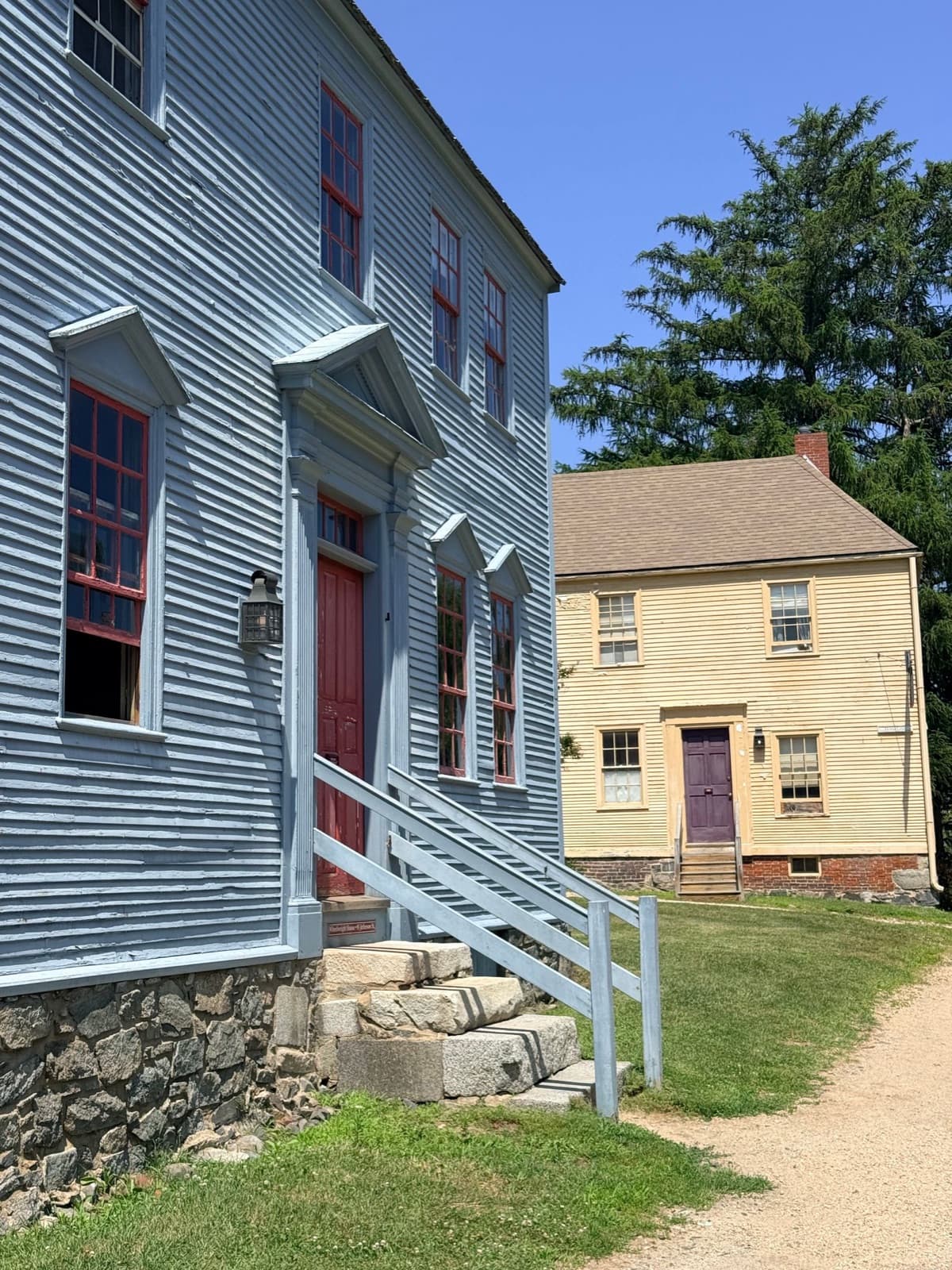 Charming colonial-style homes on a sunny day
