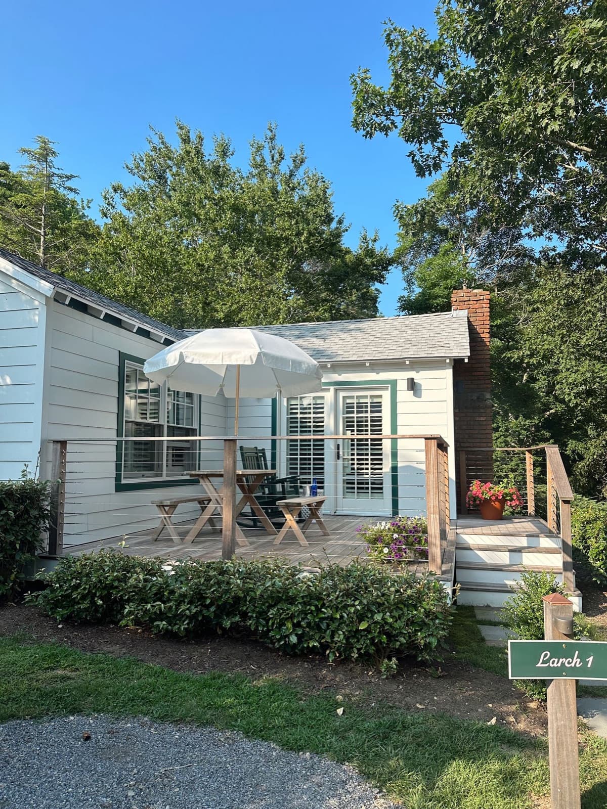 Serene cottage with a porch, patio, and garden