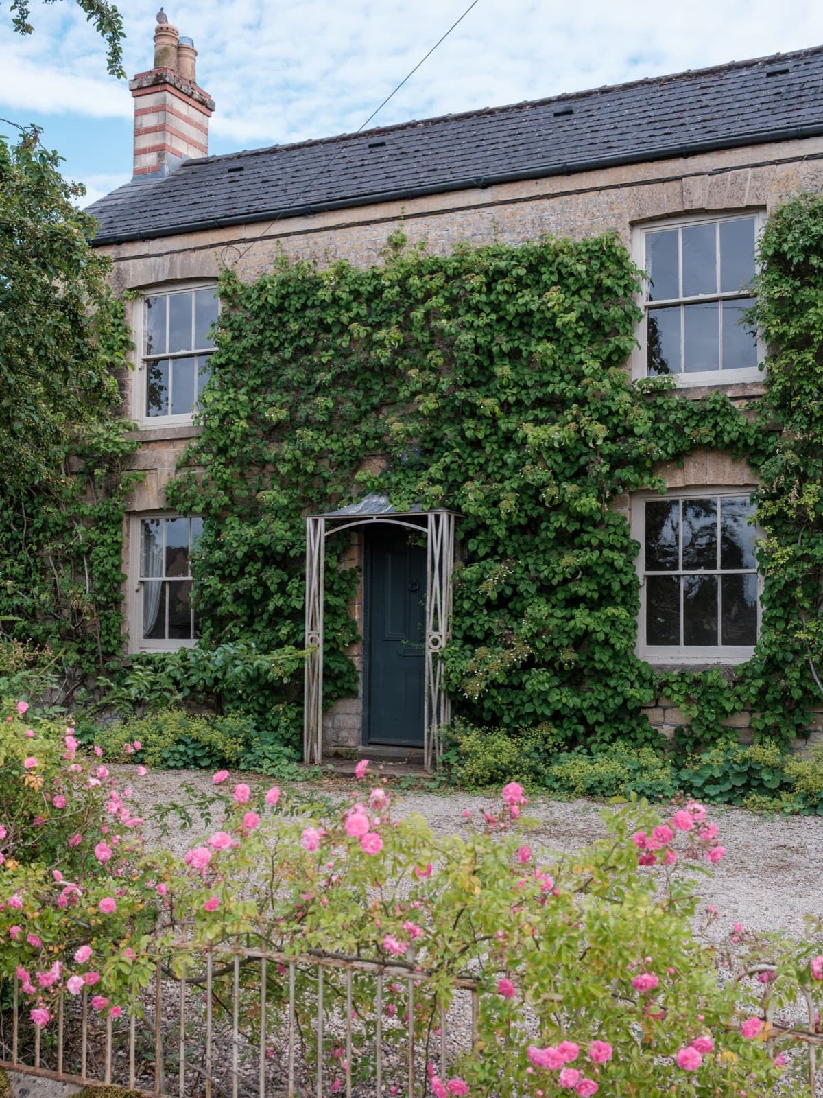 Ivy-covered cottage facade with English countryside charm