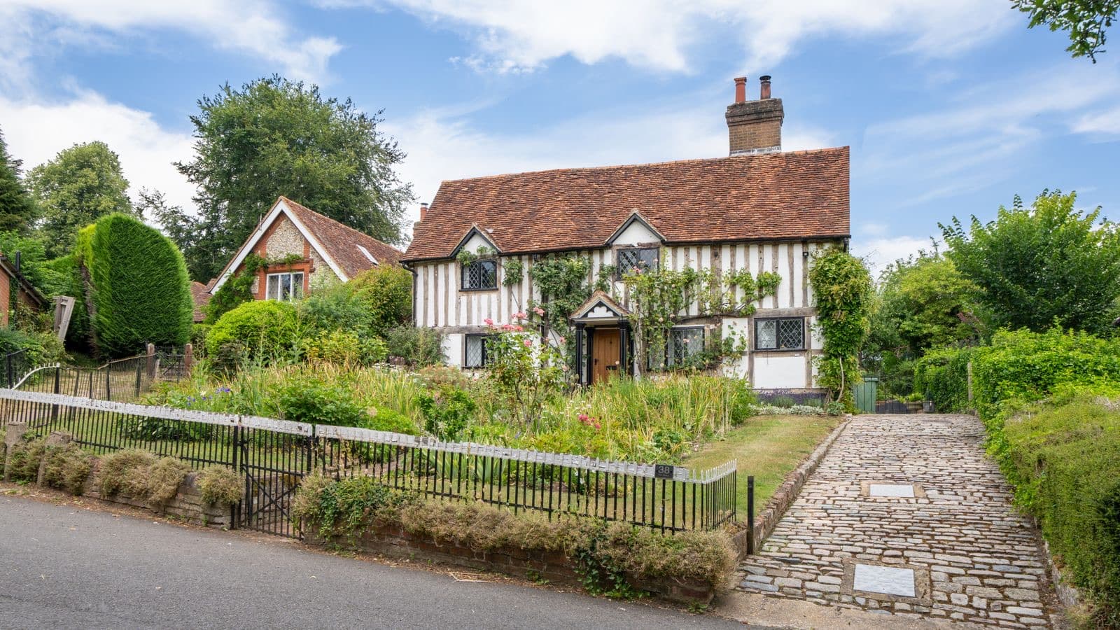 Cottage with a lush garden and rustic charm