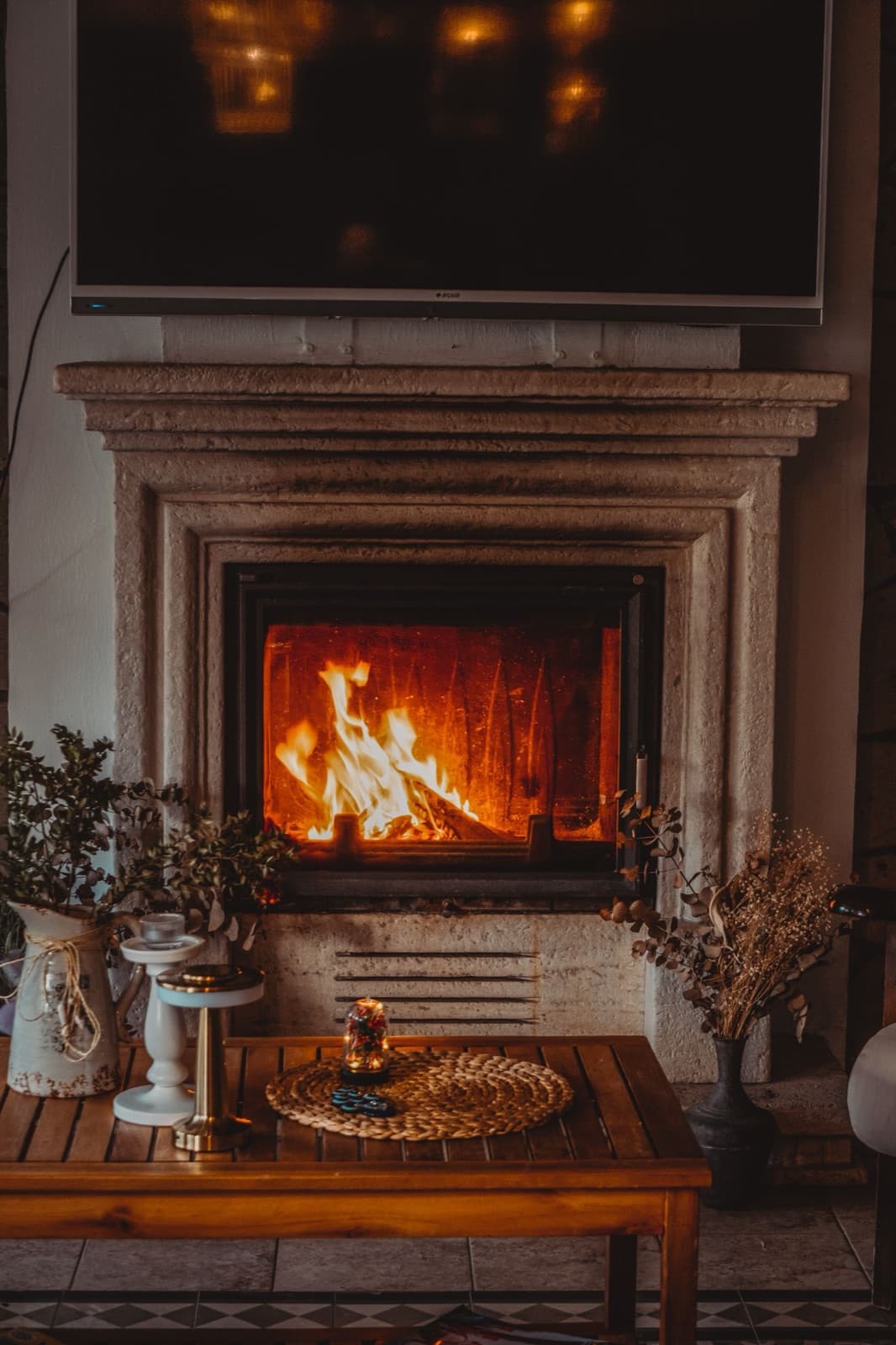 Cozy and elegant living room with a lit fireplace
