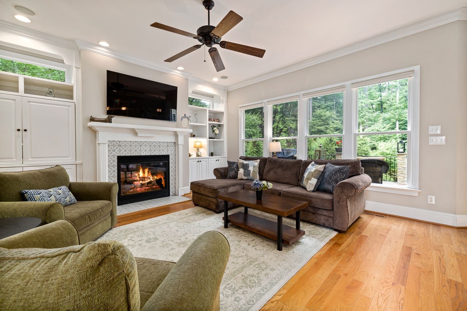 Well-designed living room with a fireplace and natural light