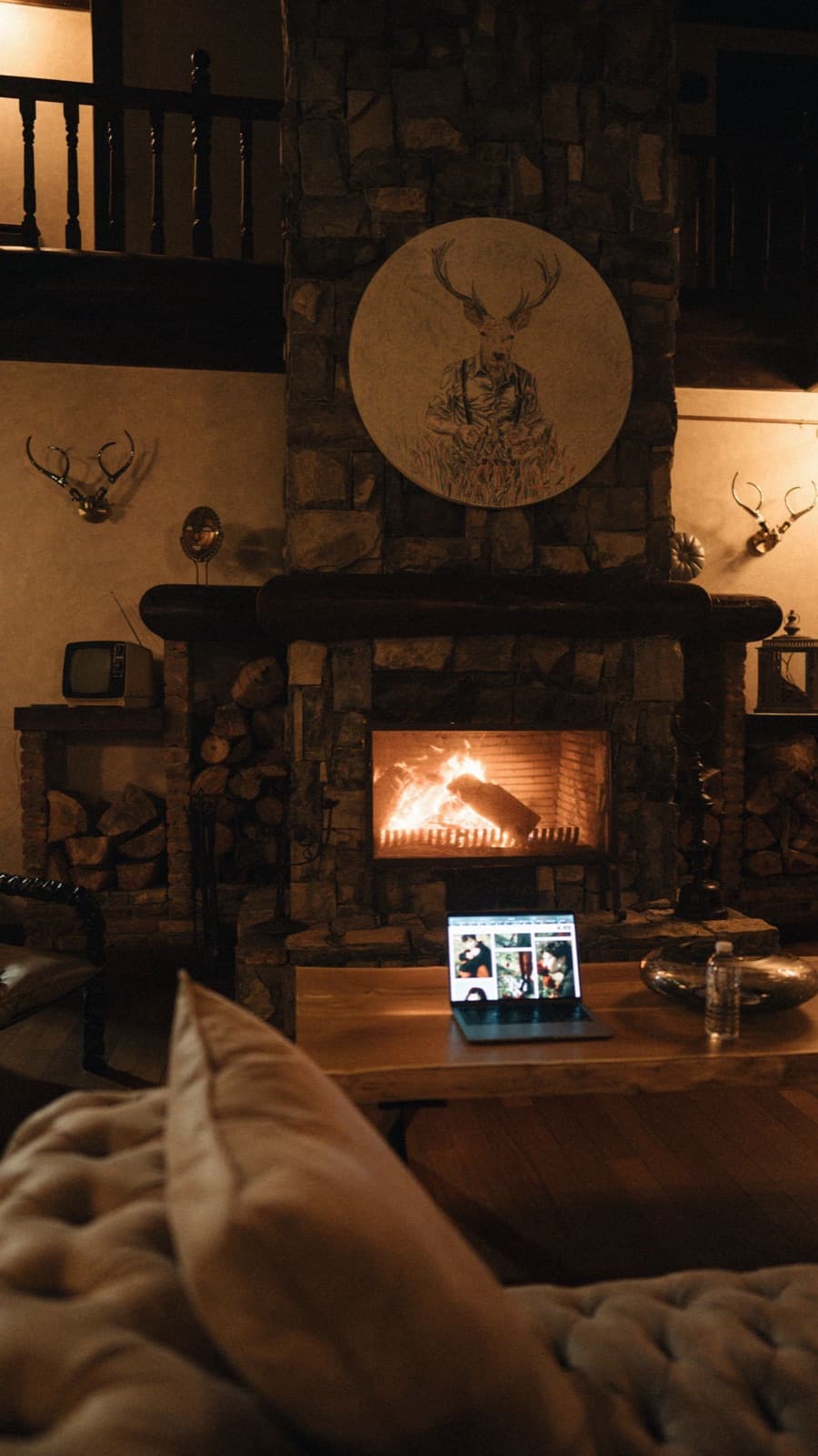 Warm cabin interior with a lit fireplace