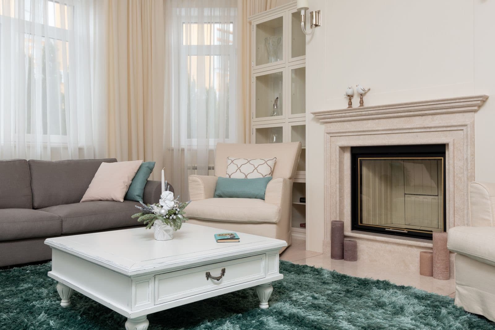 Classic living room with a sofa near a marble fireplace