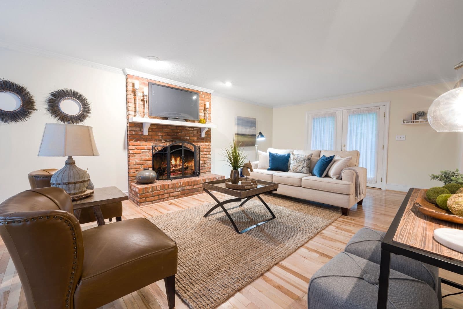 Inviting living room with a brick fireplace