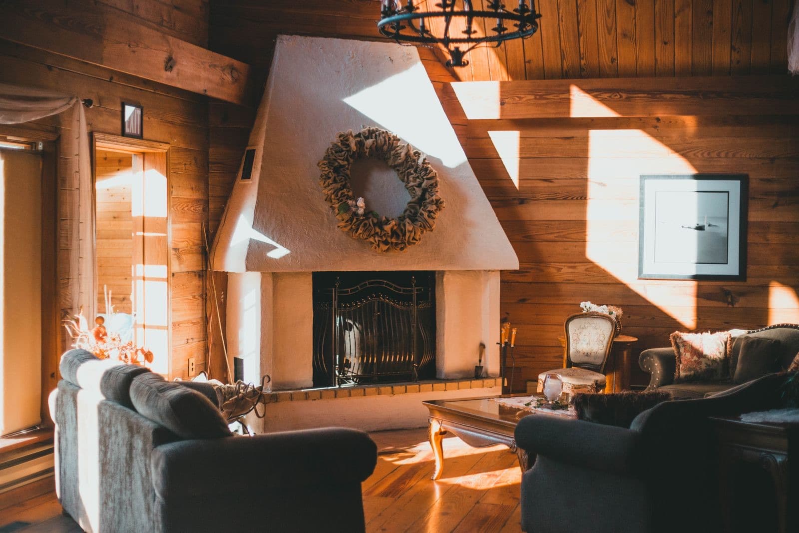 Sunlit rustic living room with a fireplace