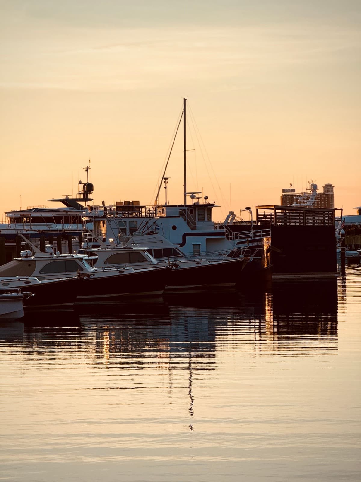 Peaceful sunset over boats at a harbor