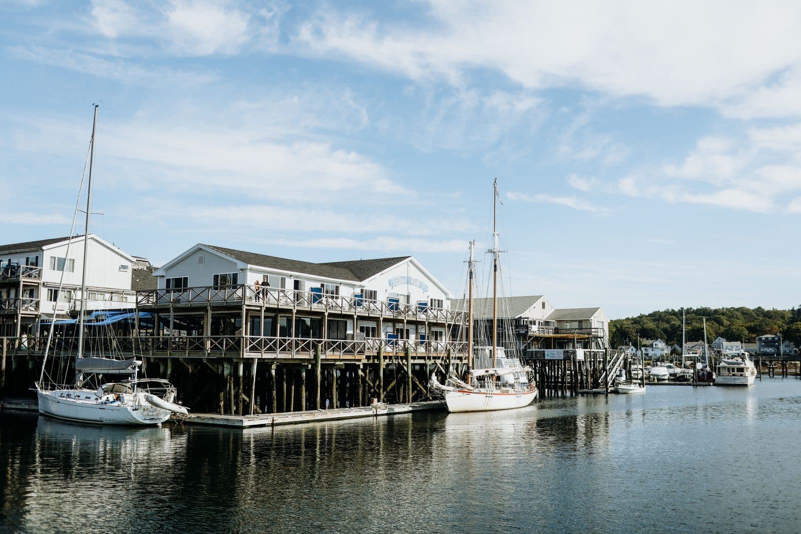 Harbor scene with sailboats and waterfront buildings