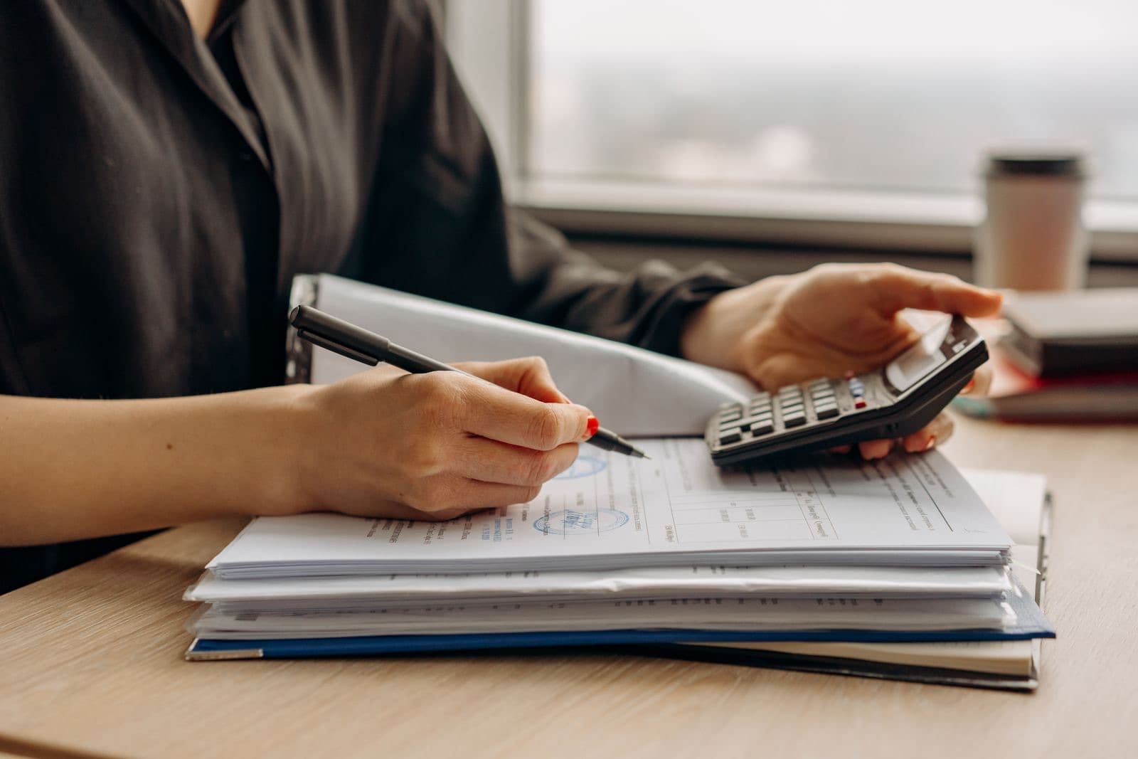 Close-up of a calculator and financial documents
